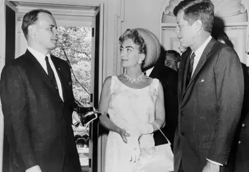 Frank Proctor, Board Chair for the National Mental Health Association, Joan Crawford, and President Kennedy
