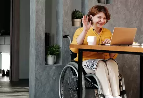 Woman in wheelchair on video call